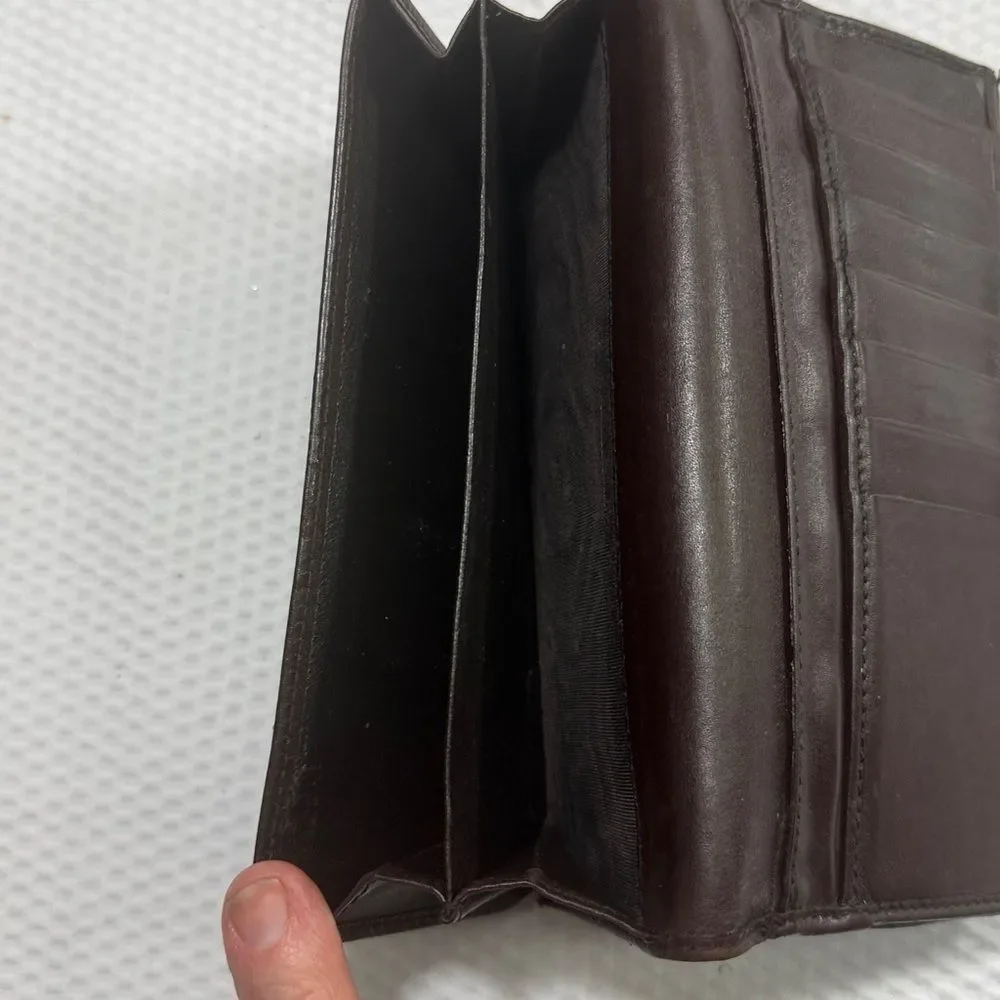 Gucci Dark Brown Embossed Clutch wallet inside is clean. GUC much life left!